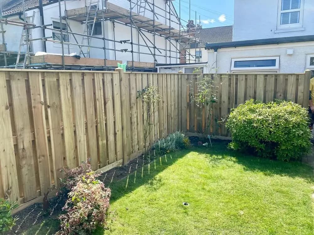 Hit and miss fencing enclosing a rear lawn while building work goes on Hit and miss fencing enclosing a rear lawn while building work goes on